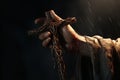 Emotional portrayal of hands holding a cross