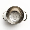 Emotional Resonance: A Detailed Silver Colander On White Surface