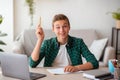 Emotional schooler having great idea, doing homework online