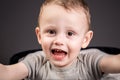 Emotional smiling boy with black rotten teeth. Dental medicine and healthcare. caries from an early age