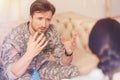 Emotional soldier communicating with psychotherapist