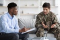 Emotional soldier gesturing while talking to psychotherapist