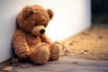 Emotional solitude Childs teddy bear alone, looking sad and disappointed