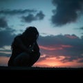 Emotional solitude Silhouette of a woman in contemplative sadness