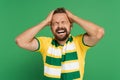 emotional sports fan in striped scarf