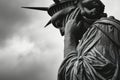 Emotional statue of liberty with her head in hands. American state of grief and depression