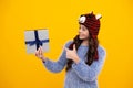 Emotional teenager child hold gift on birthday. Funny kid girl holding gift boxes celebrating happy New Year or Royalty Free Stock Photo