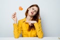 emotional woman with lollipop in her hands yellow yellow shirt isolated background Royalty Free Stock Photo