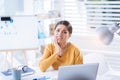 Emotional woman sitting and suffering from toothache at work Royalty Free Stock Photo