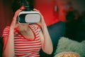 Emotional woman wear VR headset playing video game. Woman relaxing playing video games using vr headset. Caucasian Royalty Free Stock Photo