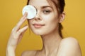 emotional women bare shoulders cotton pads and clear skin attractive look