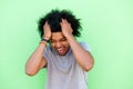 Emotional young man with hands in hair