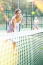 Young woman padel tennis player trains on the outdoor court Royalty Free Stock Photo