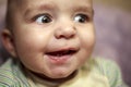 Emotions baby close up, surprise, delight, big bulging eyesPortrait of a cute baby, facial expression and emotions