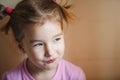 Emotions of a cunning little girl of 3 years. Royalty Free Stock Photo