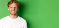 Emotions and fashion concept. Happy young man with red hair and beard, smiling and laughing at camera, standing over Royalty Free Stock Photo