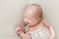 Emotions of an infant in costume sleeping, closeup Royalty Free Stock Photo