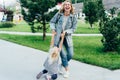 Emotions of a mom fooling around with a little daughter. Mom twirling her daughter outside. Royalty Free Stock Photo