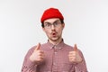 Emotions and people concept. Close-up portrait impressed funny bearded caucasian man in beanie and checked shirt, wear Royalty Free Stock Photo