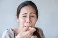 Cute asian woman tasting sour lemon. Royalty Free Stock Photo