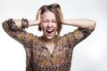 Emotions is stress, madness. concept crazy shouting. woman rending her hair. natural teenager screaming with close eyes Royalty Free Stock Photo