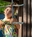 Emotions in the Sun, A Girl in the Playground Royalty Free Stock Photo