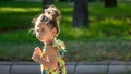 Emotions in the Sun, A Girl in the Playground dancing with his inflated cheeks Royalty Free Stock Photo