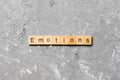 EMOTIONS word written on wood block. EMOTIONS text on cement table for your desing, concept Royalty Free Stock Photo