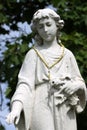 Beautiful statue of angel with rosary beads and broken fingers, St.Agnes Cemetery, menands, New York, 2021