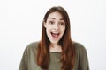 Emotive happy girl cheerfully talking with friends in cafe. Portrait of satisfied grinning european woman with pleased