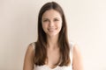 Emotive headshot portrait of cheerful young woman