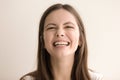 Emotive headshot portrait of laughing young woman Royalty Free Stock Photo