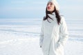 Emotive portrait of fashionable model in white coat and beret