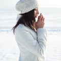 Emotive portrait of fashionable model in white coat and beret Royalty Free Stock Photo