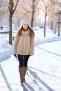 Emotive portrait of a fashionable model in white coat and beret Royalty Free Stock Photo