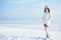 Emotive portrait of fashionable model in white coat and beret Royalty Free Stock Photo