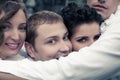 Emotive portrait of four smiling close friends - street actors