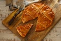 Empanada Gallega, traditional pie stuffed with tuna or meat typical of Galicia, Spain, on a wooden background