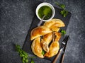 Empanadas with chimichurri sauce. Traditional Latin American cuisine