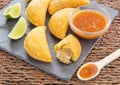 Colombian empanada with spicy sauce