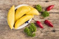 Empanadas and hot pepper on wooden background, traditional Colombian food Royalty Free Stock Photo