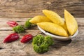Empanadas and hot pepper on wooden background, traditional Colombian food Royalty Free Stock Photo