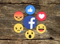 Empathetic Emoji Reactions on wooden background Royalty Free Stock Photo