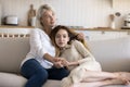 Empathetic grandmother hugging thoughtful teenage grandkid girl with love Royalty Free Stock Photo