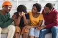 Empathetic black friends supporting upset young lady Royalty Free Stock Photo