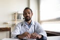 Empathetic young mixed raced doctor giving online help