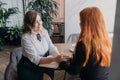 Empathy, friendly support, each other& x27;s support and sisterhood. Young woman comforting her friend sitting in cafe Royalty Free Stock Photo