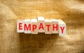 Empathy symbol. The concept word Empathy on wooden blocks. Beautiful canvas background, copy space. Business, psychological and Royalty Free Stock Photo