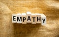 Empathy symbol. The concept word Empathy on wooden blocks. Beautiful canvas background, copy space. Business, psychological and Royalty Free Stock Photo