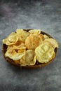 Emping is fried crunchy chips made from mashed gnetum or melinjo